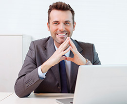 Man in front of a Laptop